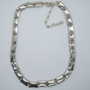 Silver colored pillow necklace